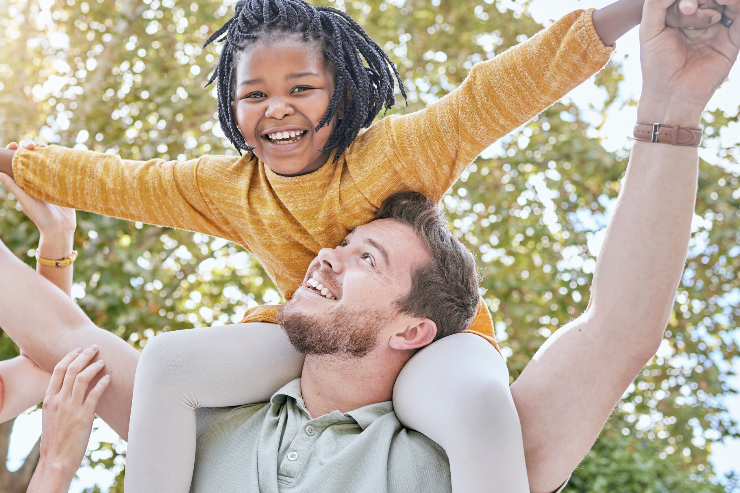 adopted daughter on her dad's shoulders